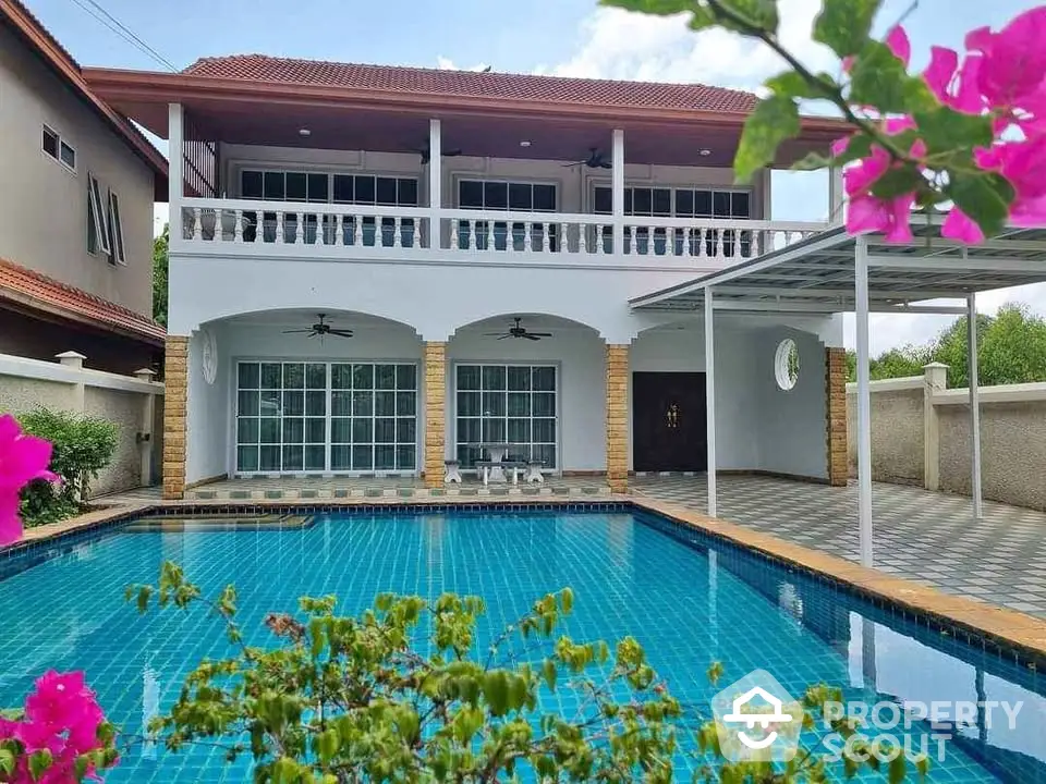 Stunning two-story villa with private pool and spacious balcony, perfect for luxurious living.