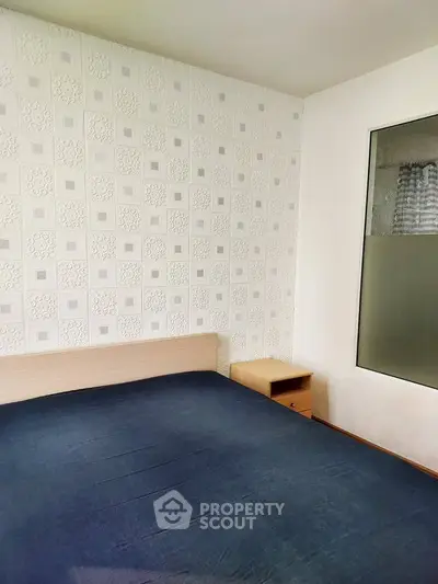 Cozy bedroom with modern decor and stylish wallpaper