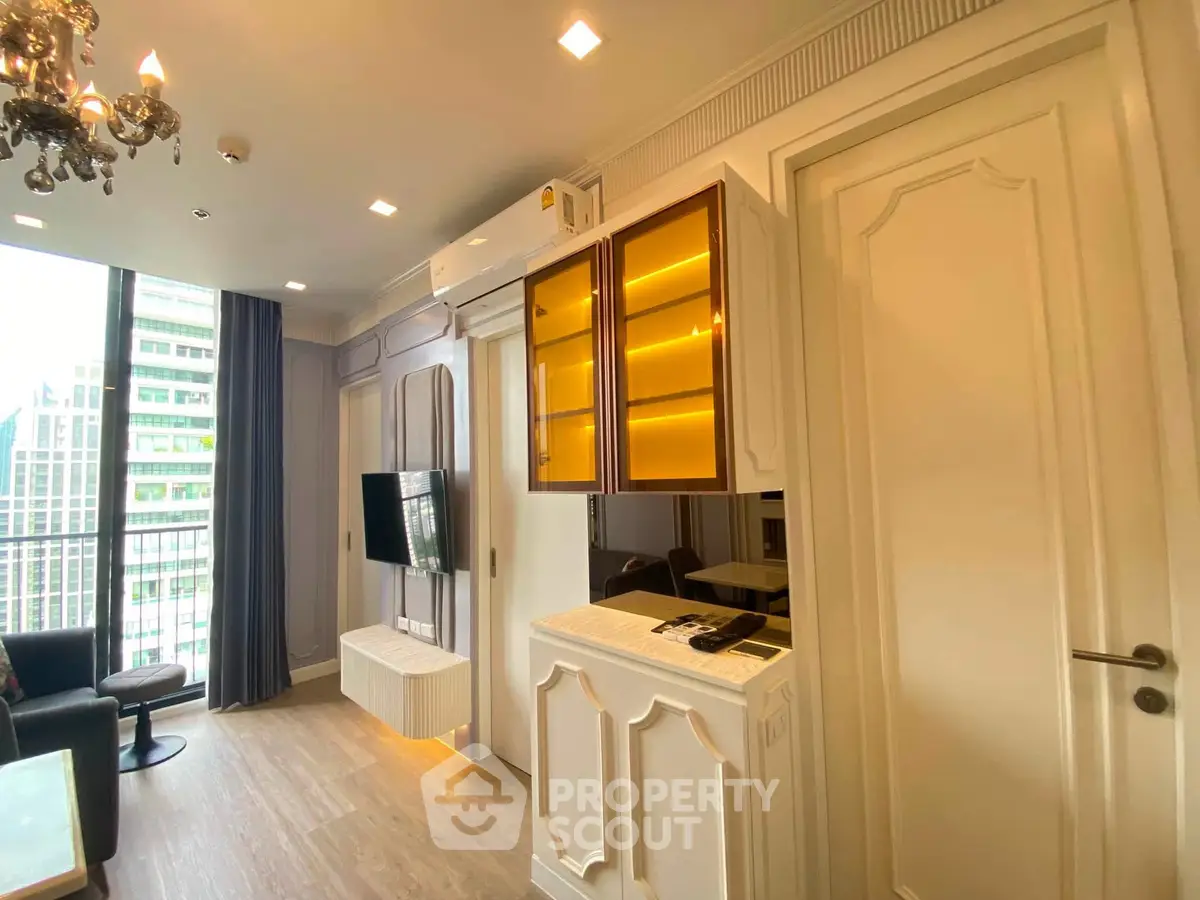 Luxurious modern living room with elegant decor and city view, featuring stylish cabinetry and ambient lighting.