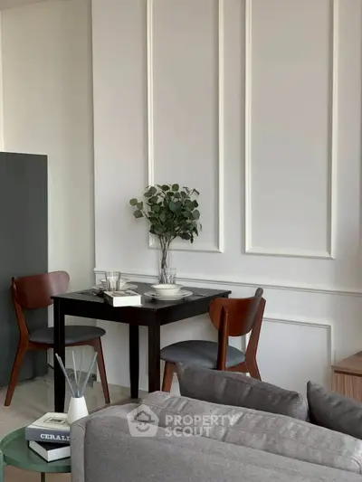 Stylish dining nook with elegant wall paneling and modern furniture