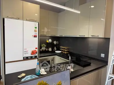 Modern kitchen with sleek cabinetry and built-in appliances