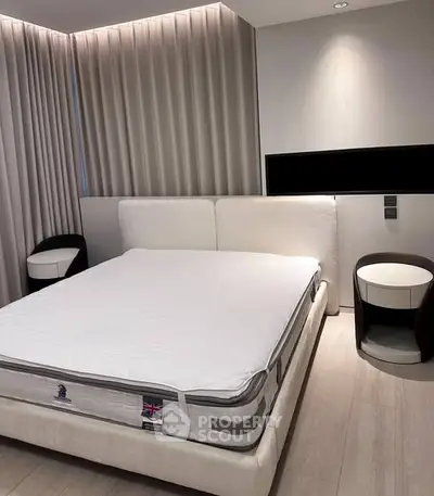 Modern bedroom with elegant design and luxurious bed in a stylish apartment.
