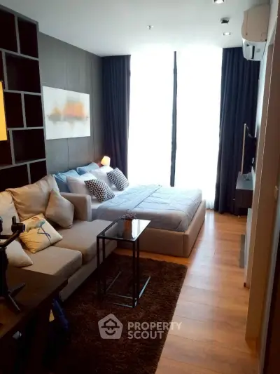 Modern studio apartment with cozy living area and stylish decor