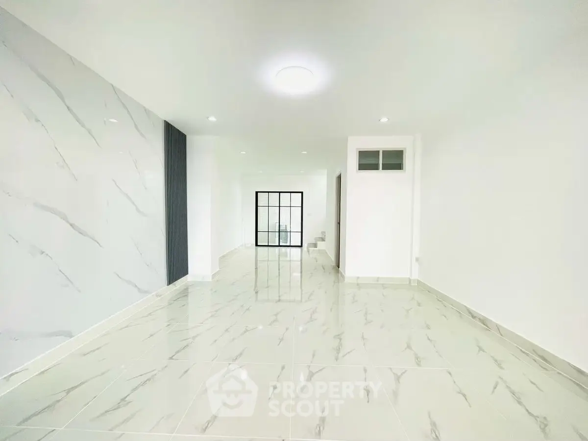 Spacious modern living room with marble flooring and sleek design