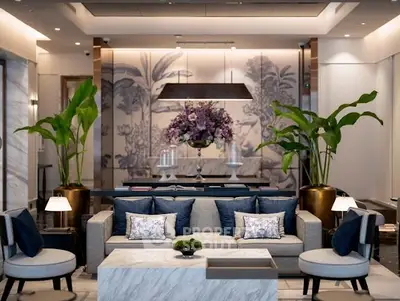 Luxurious living room with elegant decor and modern furniture, featuring a stylish marble coffee table and lush plants.