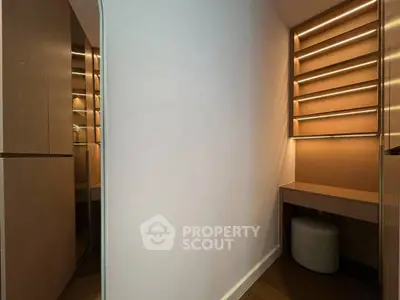 Modern minimalist study nook with built-in shelves and ambient lighting