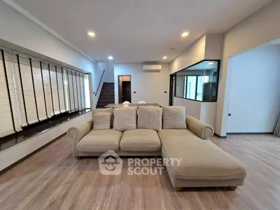 Spacious modern living room with cozy sectional sofa and stylish decor