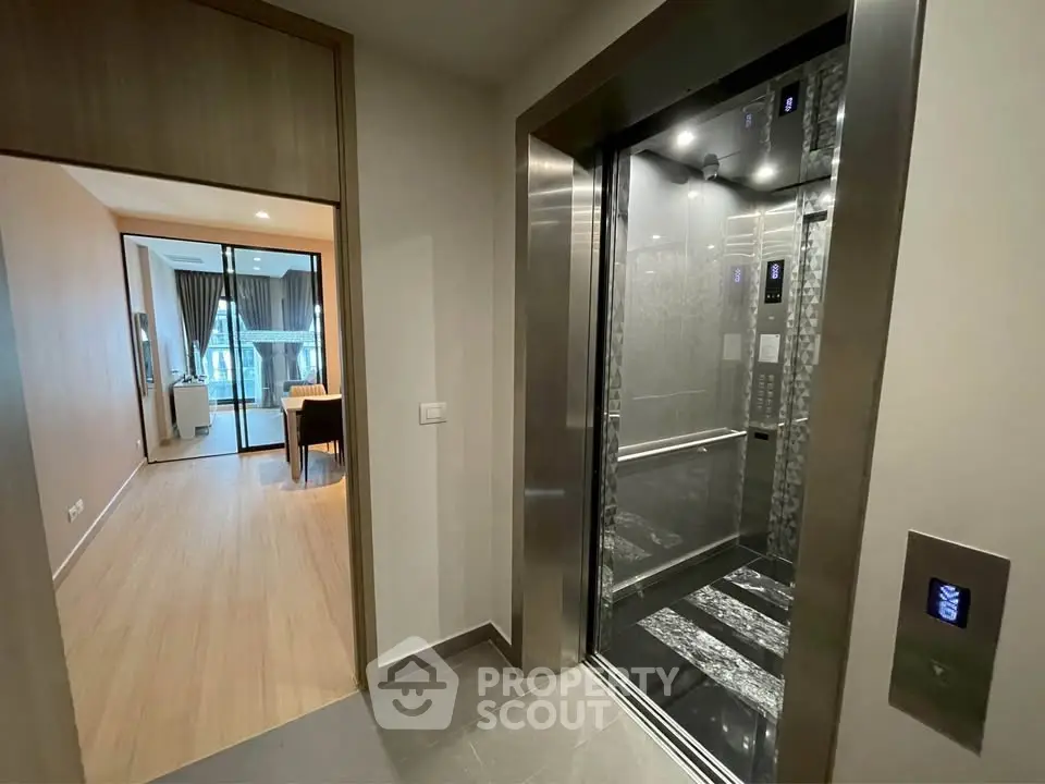 Modern apartment with sleek elevator and stylish interior design.