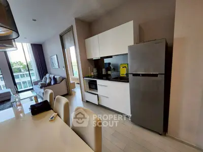 Modern kitchen with sleek appliances and open layout in stylish apartment