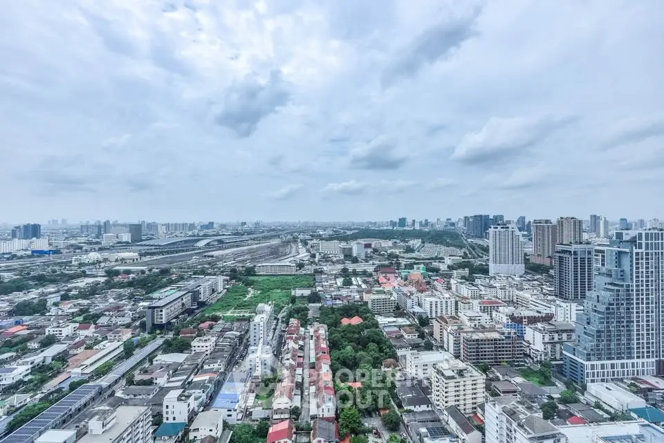 Stunning panoramic cityscape view from high-rise apartment, showcasing urban skyline and vibrant neighborhood.