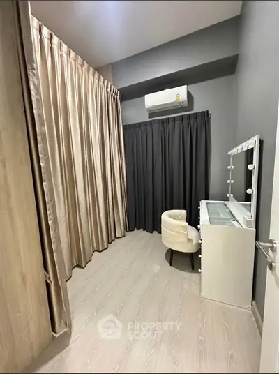 Chic study room with modern vanity and elegant curtains, perfect for a stylish home office setup.