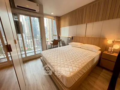 Modern bedroom with city view, featuring wooden accents and a cozy atmosphere.