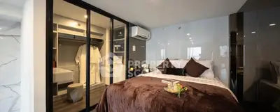 Luxurious bedroom with walk-in closet and modern decor