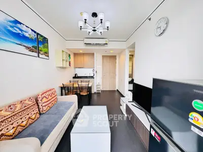 Modern living room with stylish decor and open kitchen layout