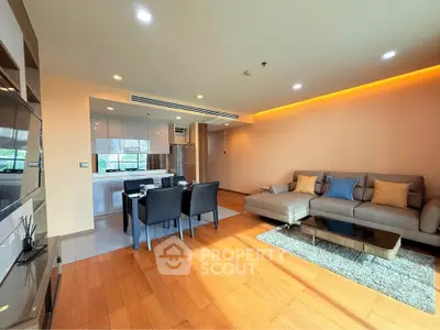 Spacious modern living room with open kitchen and elegant dining area