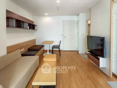 Modern living room with sleek furniture and wooden flooring