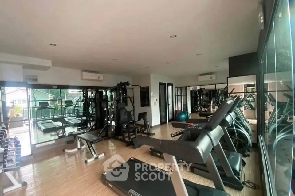 Spacious modern gym with state-of-the-art equipment and large mirrors