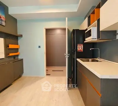Modern kitchen with sleek cabinetry and open layout design