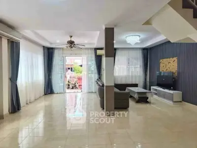 Spacious modern living room with elegant decor and ample natural light