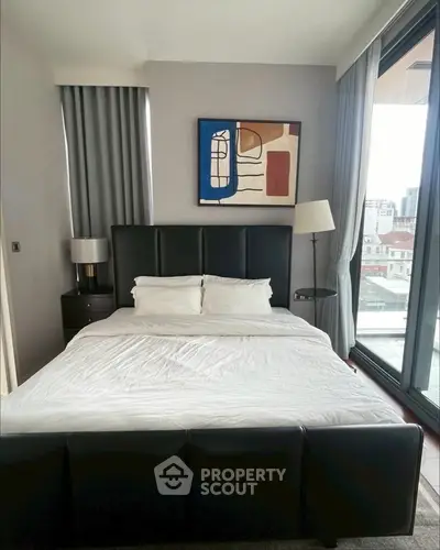 Modern bedroom with city view and stylish decor