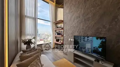 Luxurious high-rise living room with floor-to-ceiling windows and modern decor.