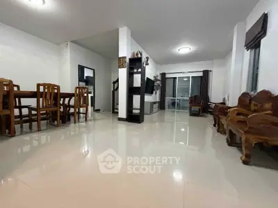 Spacious living room with elegant wooden furniture and modern decor