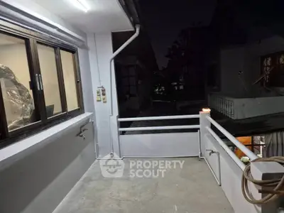 Cozy balcony with night view, perfect for relaxation and outdoor enjoyment.