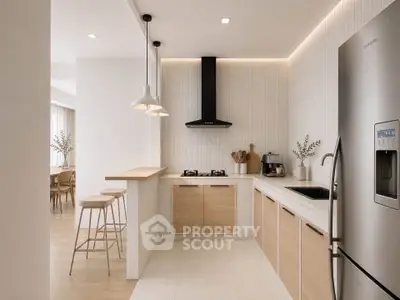 Modern kitchen with sleek design, featuring stainless steel appliances and open layout.