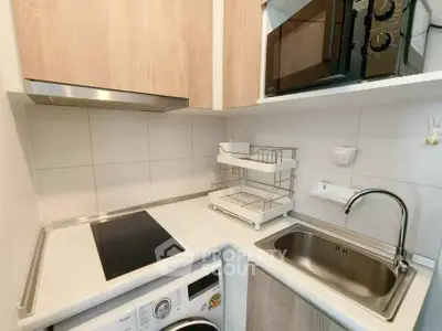 Modern compact kitchen with sleek appliances and efficient layout