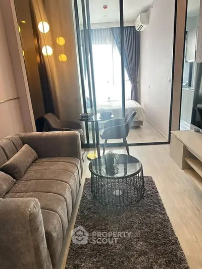 Modern living room with cozy sofa and stylish decor in a contemporary apartment.