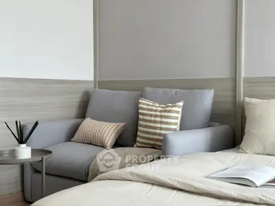 Cozy bedroom with stylish sofa and modern decor