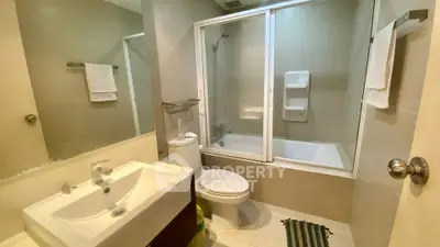 Modern bathroom with bathtub and sleek fixtures in a contemporary apartment.