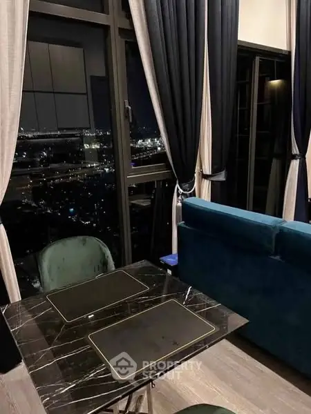 Luxurious high-rise living room with stunning night city view
