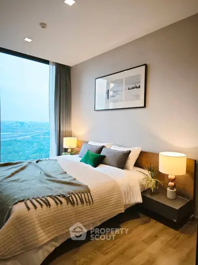 Luxurious bedroom with stunning city view and modern decor