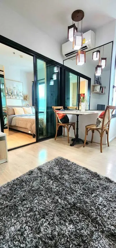 Modern apartment interior with cozy living area and stylish bedroom view.