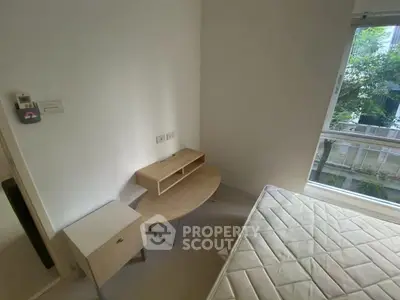 Cozy bedroom with natural light and minimalist furniture