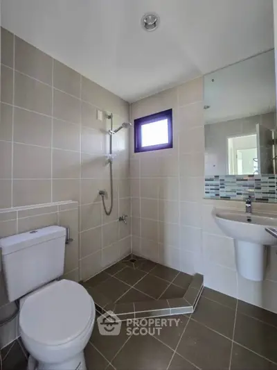 Modern bathroom with sleek tiles and contemporary fixtures