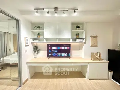 Modern living room with sleek TV unit and stylish decor