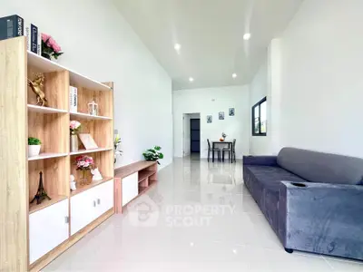 Spacious modern living room with sleek tile flooring and stylish decor