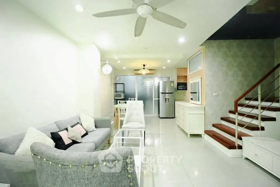 Spacious modern living room with open kitchen and stylish decor