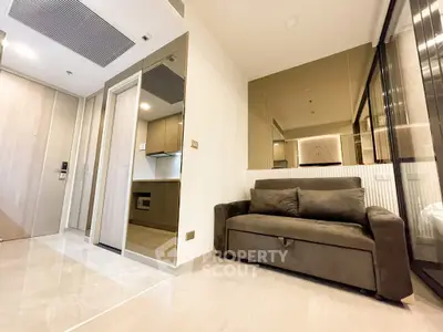 Modern living room with sleek design and comfortable sofa in a stylish apartment.