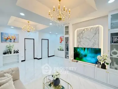 Luxurious living room with elegant chandeliers and modern decor