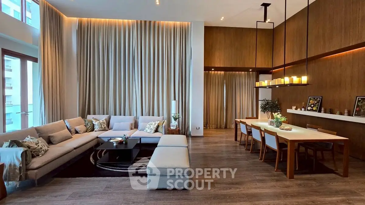 Luxurious modern living room with high ceilings and elegant dining area