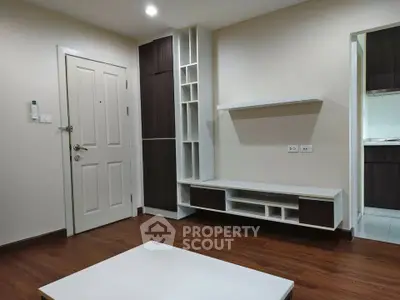 Modern living room with sleek built-in storage and wooden flooring