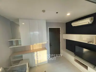 Modern living room with sleek built-in storage and air conditioning