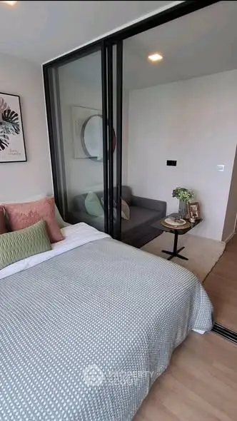 Modern bedroom with sliding glass doors and cozy decor