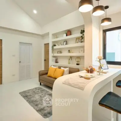 Modern living room with cozy sofa, stylish bar counter, and elegant lighting.