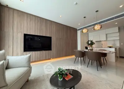 Modern open-plan living room with sleek kitchen and stylish decor