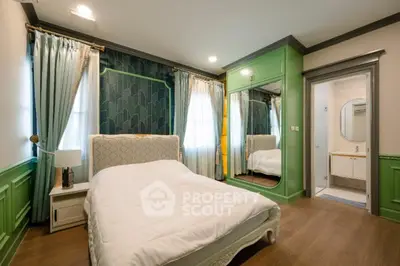 Luxurious bedroom with elegant green accents and stylish decor