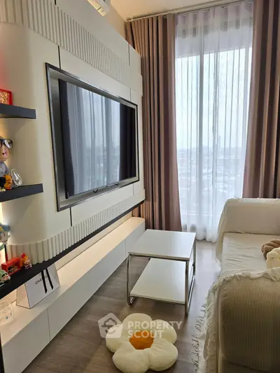 Modern living room with large TV, stylish shelving, and floor-to-ceiling window with city view.